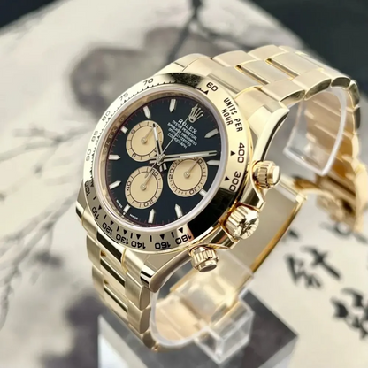 B – Rolex Cosmograph Daytona Yellow Gold Paul Newman Dial