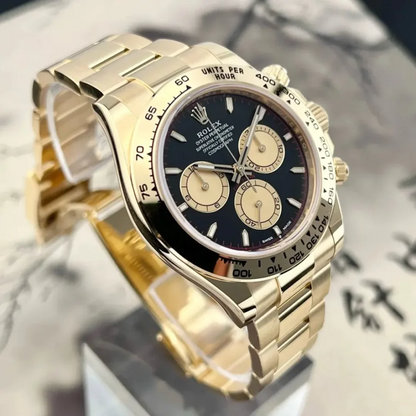 B – Rolex Cosmograph Daytona Yellow Gold Paul Newman Dial