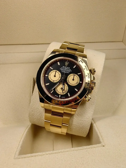 B – Rolex Cosmograph Daytona Yellow Gold Paul Newman Dial